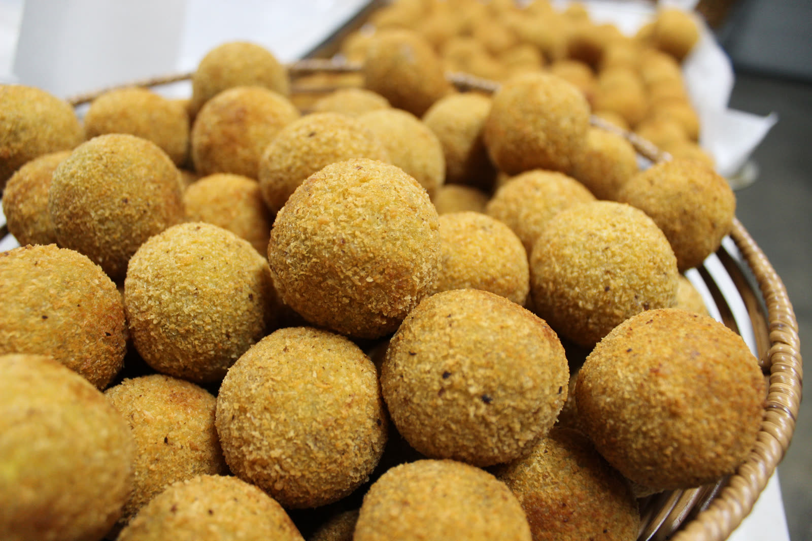 Basket of golden crumbed Sri Lankan cutlets ready to serve