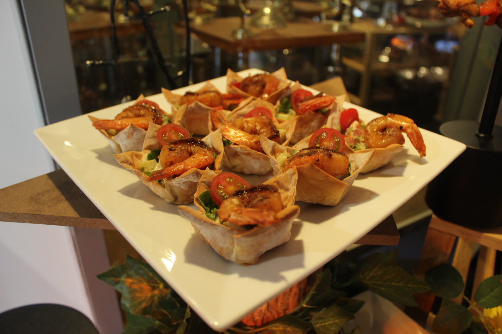 Grilled prawn filo cups with avocado salsa and cherry tomatoes